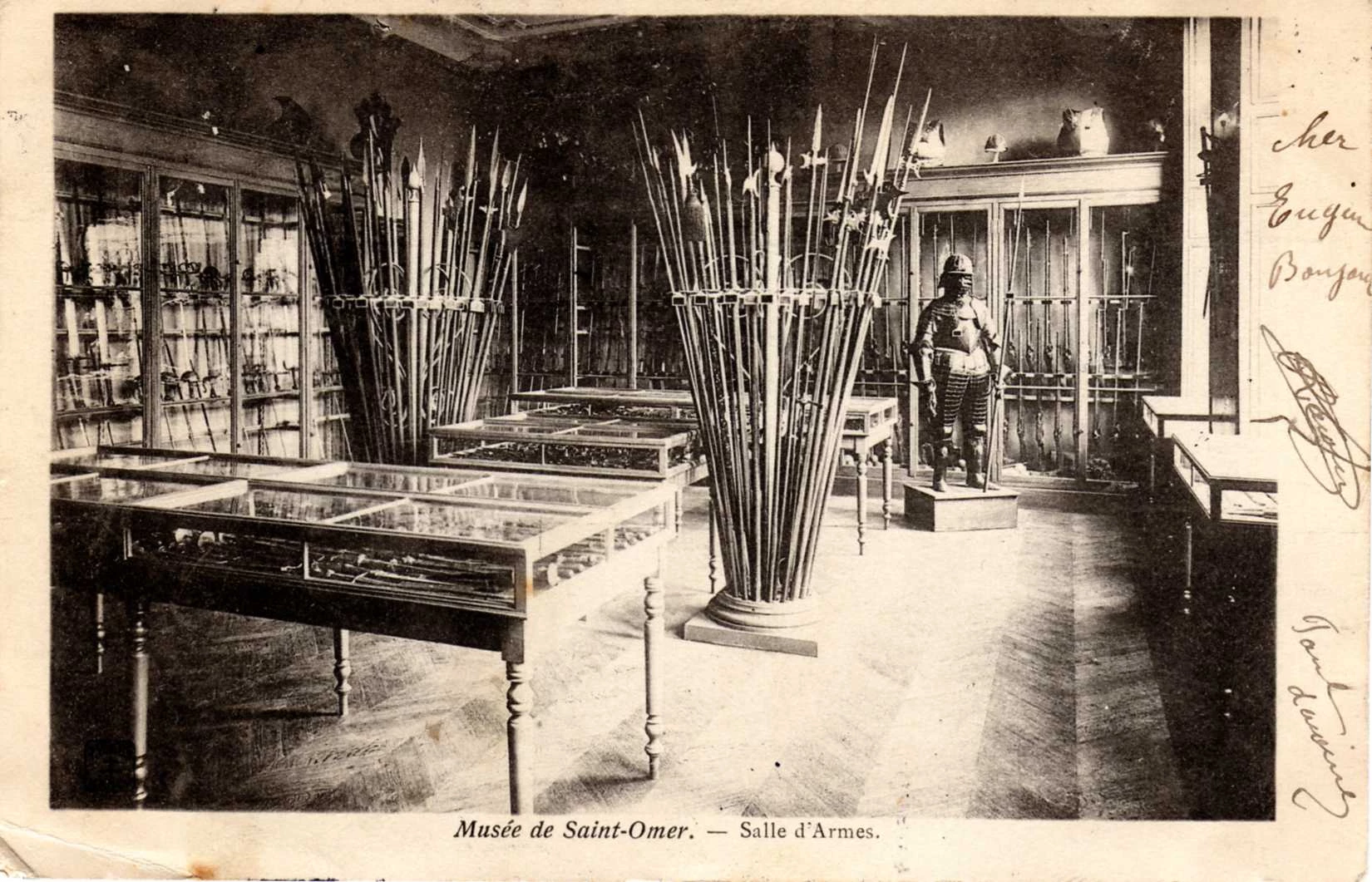 (g)- La salle d'armes